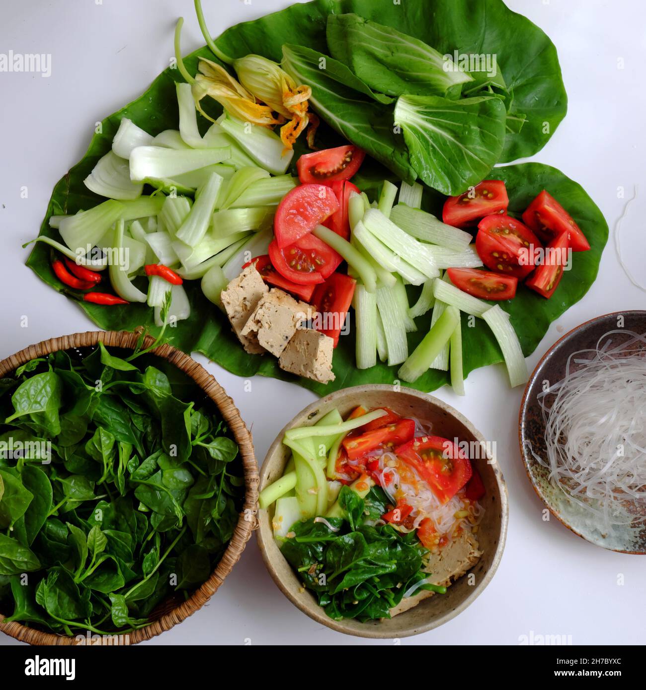 Vietnamese green vegetables hot pot, tomato, bok choy, tofu skin