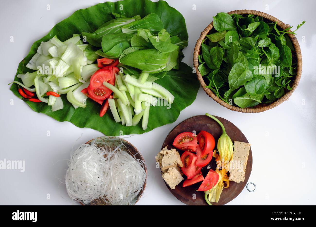 Vietnamese green vegetables hot pot, tomato, bok choy, tofu skin