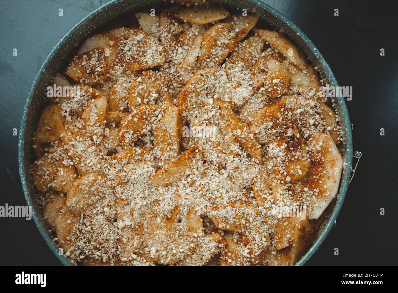 Close-up of raw apple pie in baking dish Stock Photo