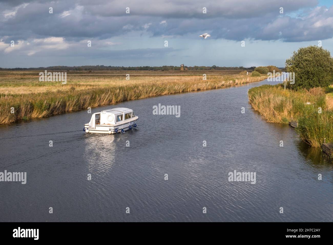 Pleasure boat on The River Thurne, Norfolk Broads, at Martham, Norfolk, England. Stock Photo