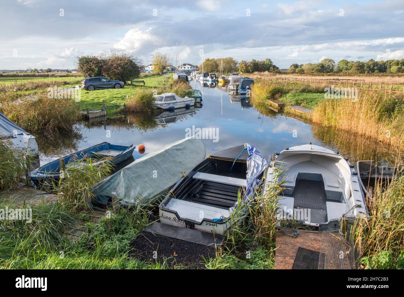 Boats moored on Martham Staithe, a dyke off The River Thurne at Martham, Norfolk Broads, Norfolk, England. Stock Photo