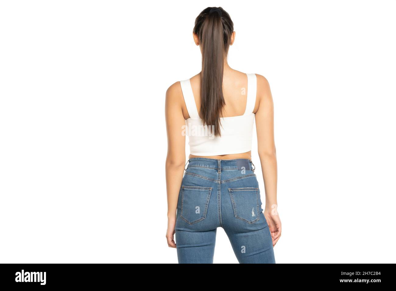 rear view of a young beautiful woman with  ponytail on a white background Stock Photo