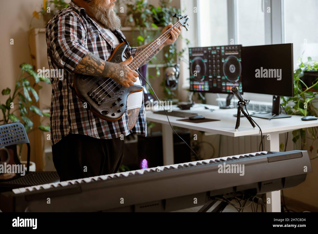 Composer plays electric guitar recording track in home audio studio closeup Stock Photo Alamy
