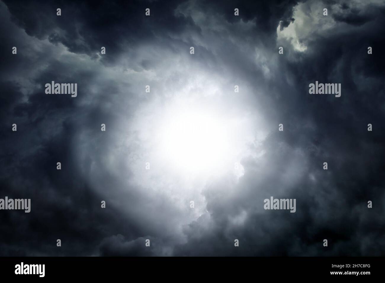 White Hole in the Dark Storm Clouds Stock Photo