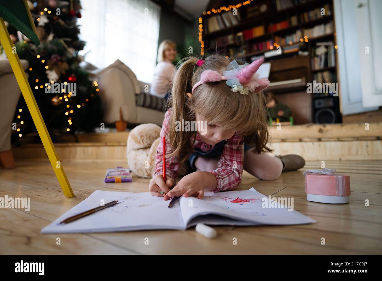 Happy child girl playing and having fun at home Stock Photo