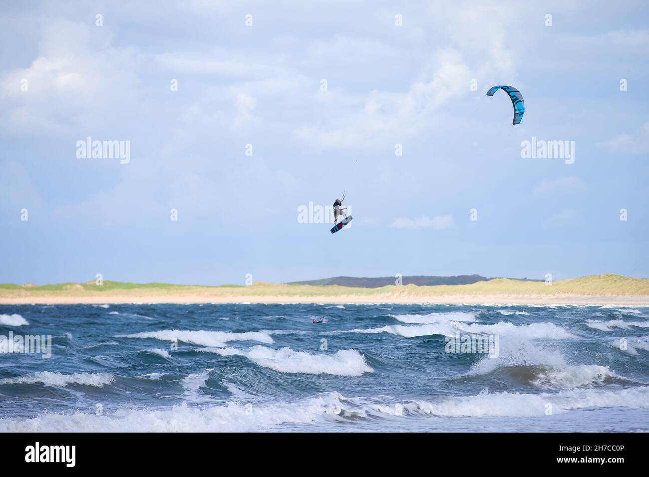 Kite surfers catching air off the Co. Sligo coast in the Atlantic Ocean off Ireland's west coast.  Just some of the fun on the Wild Atlantic Way. Stock Photo