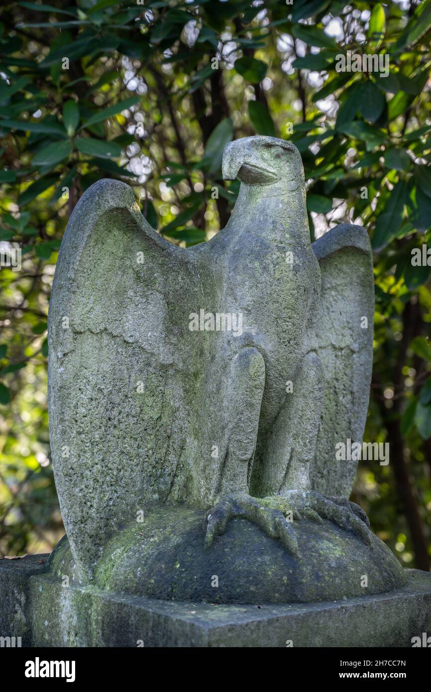 Eagle of the german empire on a soldier cemetary called 'Ehrenfriedhof' in Mülheim an der Ruhr, Germany. Bird has it's wings spreaded. Stock Photo