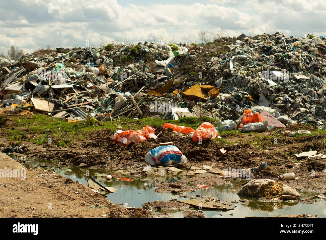 Garbage dump. Illegal dump in Russia. Garbage and writing waste. Harm