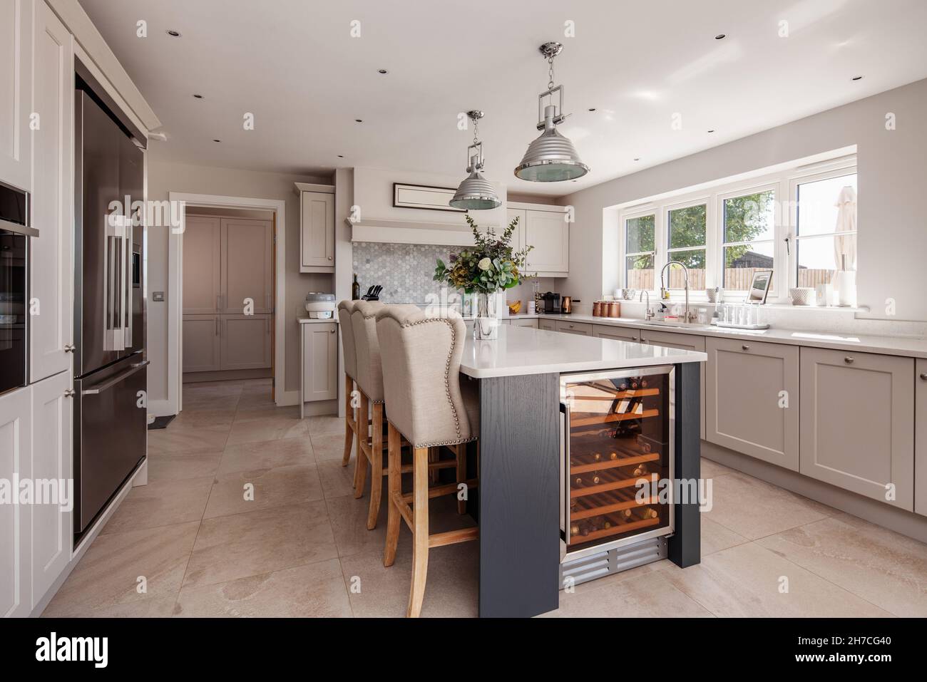 Lawshall, Suffolk, England - May 29 2020: Aspirational luxury fitted kitchen with built in appliances, wine store and peninsula breakfast bar Stock Photo