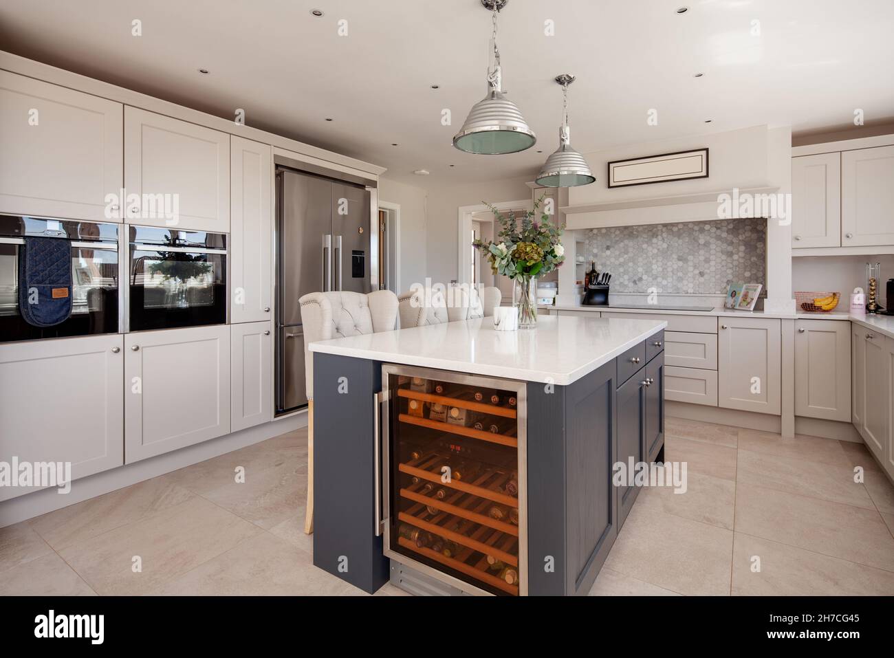 Lawshall, Suffolk, England - May 29 2020: Aspirational luxury fitted kitchen with built in appliances, wine store and peninsula breakfast bar Stock Photo