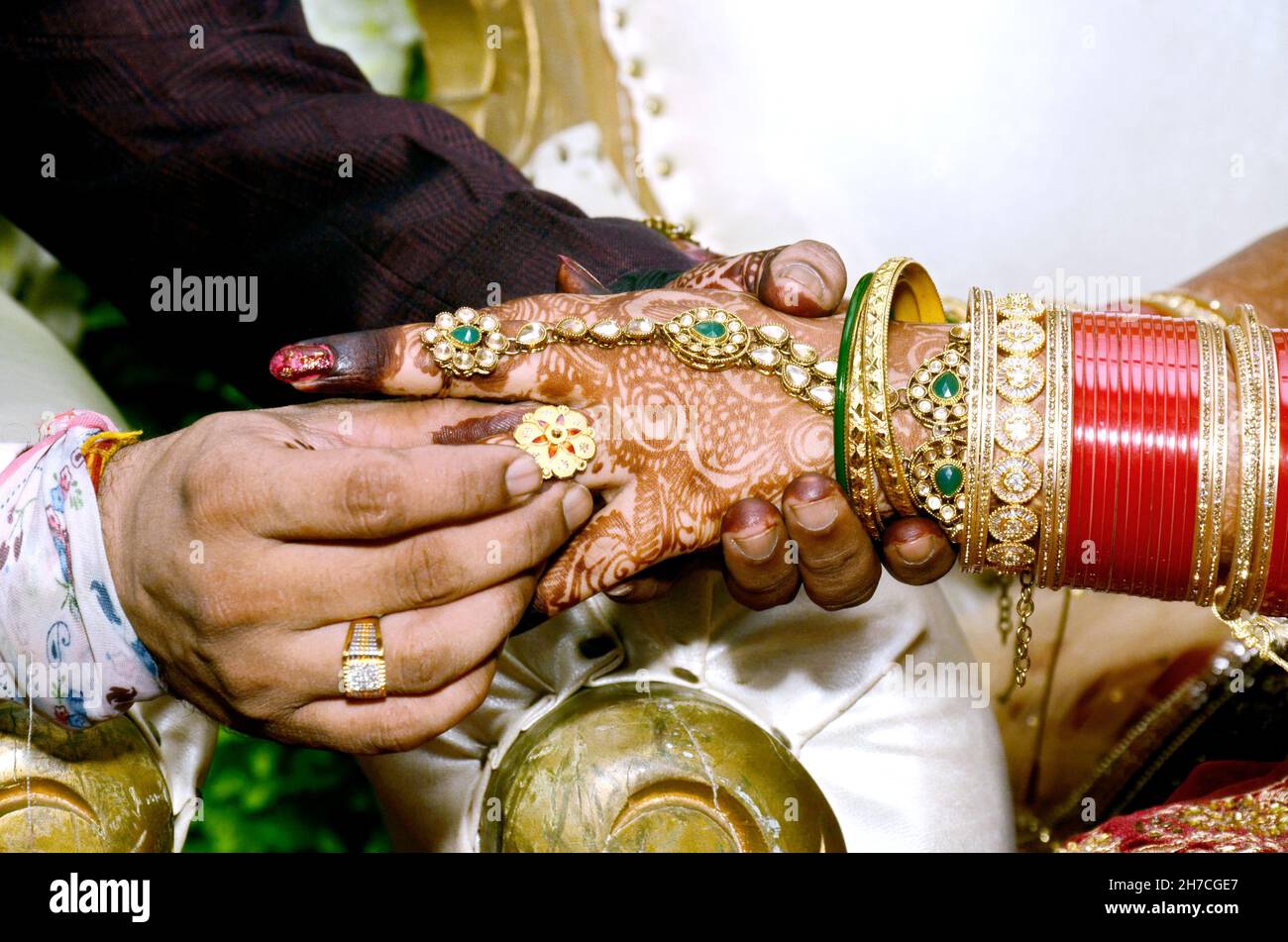 Wearing a ring at the engagement ceremony in india Stock Photo