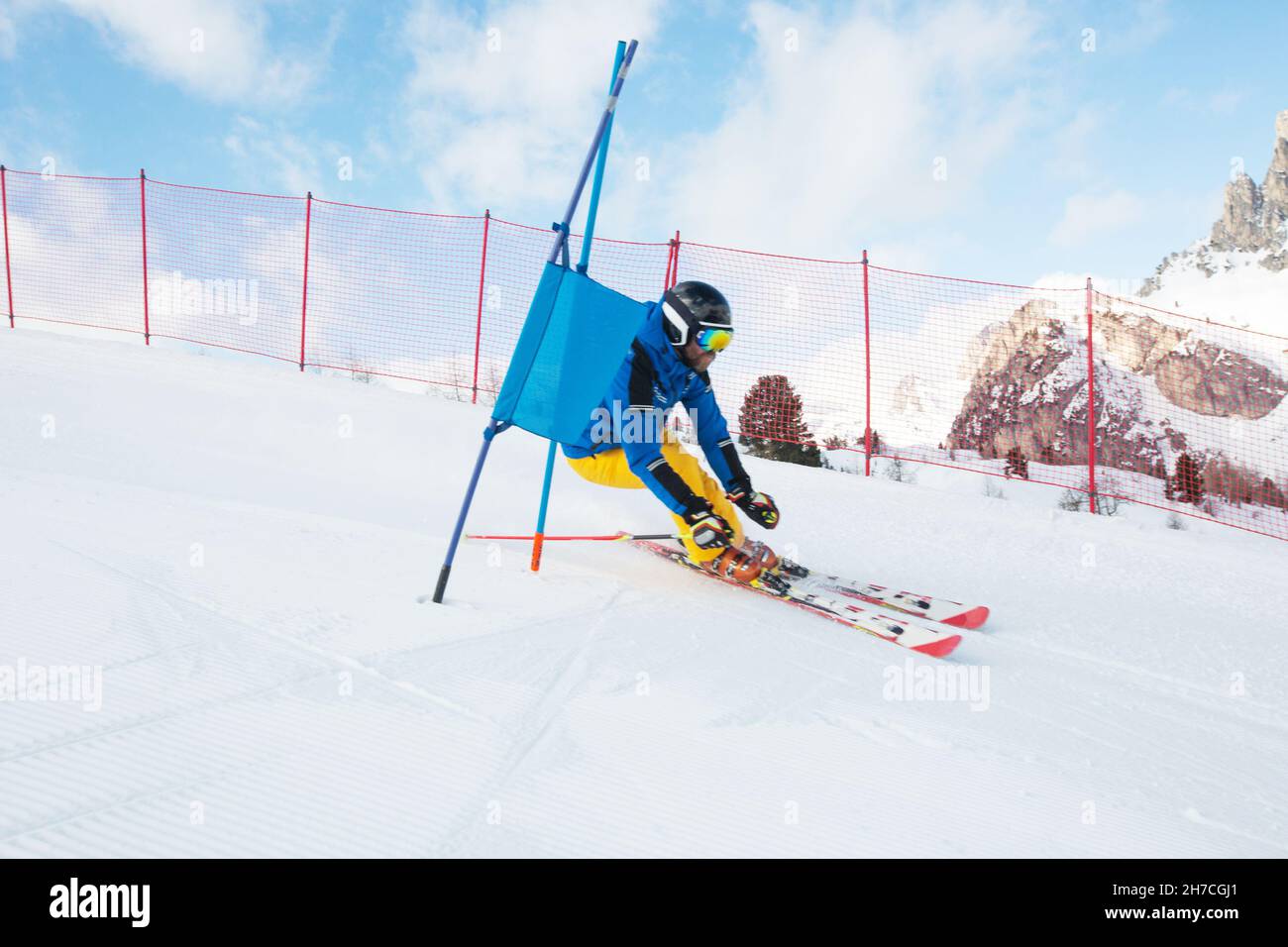 Gs Giant Slalom alpine ski racer skiing down the slope with gates sport