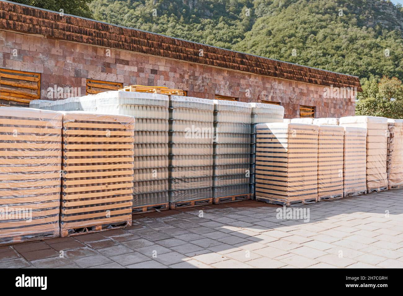 Packages with glass containers on the street near a warehouse at a wine