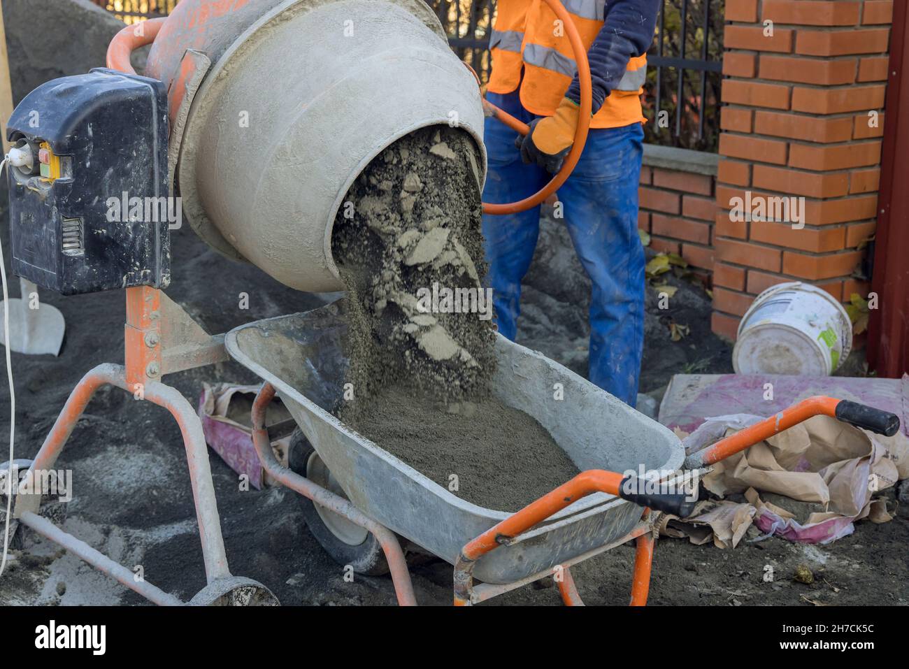 Mixing a sandy base for setting paving stones Stock Photo Alamy