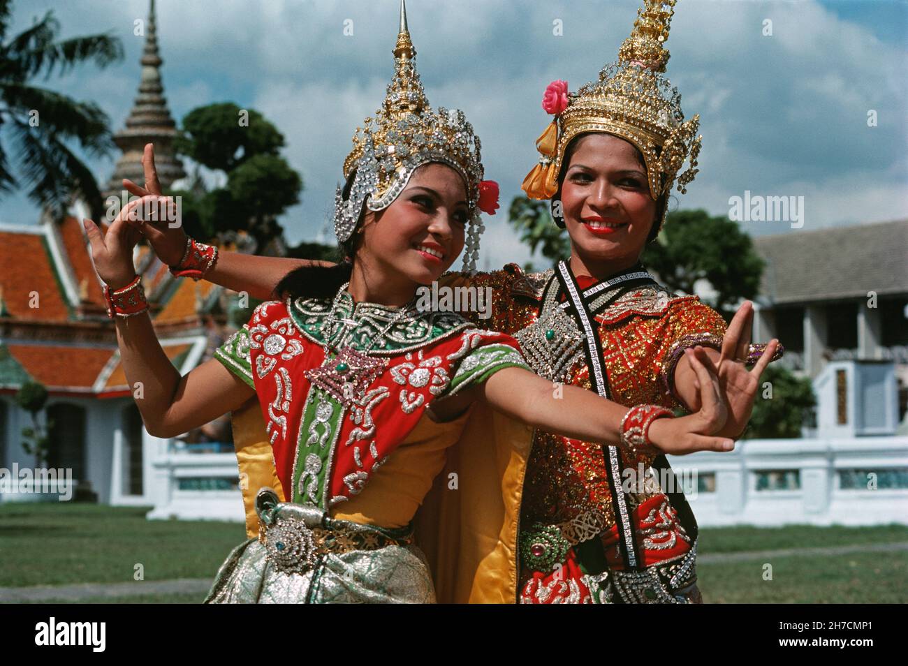 Thailand. Bangkok. Grand Palace. Two professional, female Thai dancers posing outdoors. Stock Photo