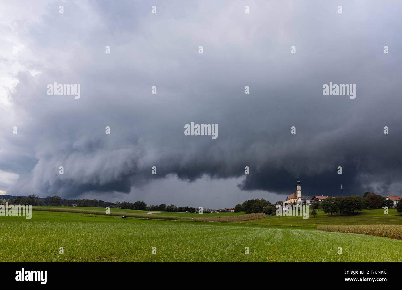 approaching thunderstorm over Bavarian cultural landscape, Germany, Bavaria, Voralpenland, Hoeselwang Stock Photo