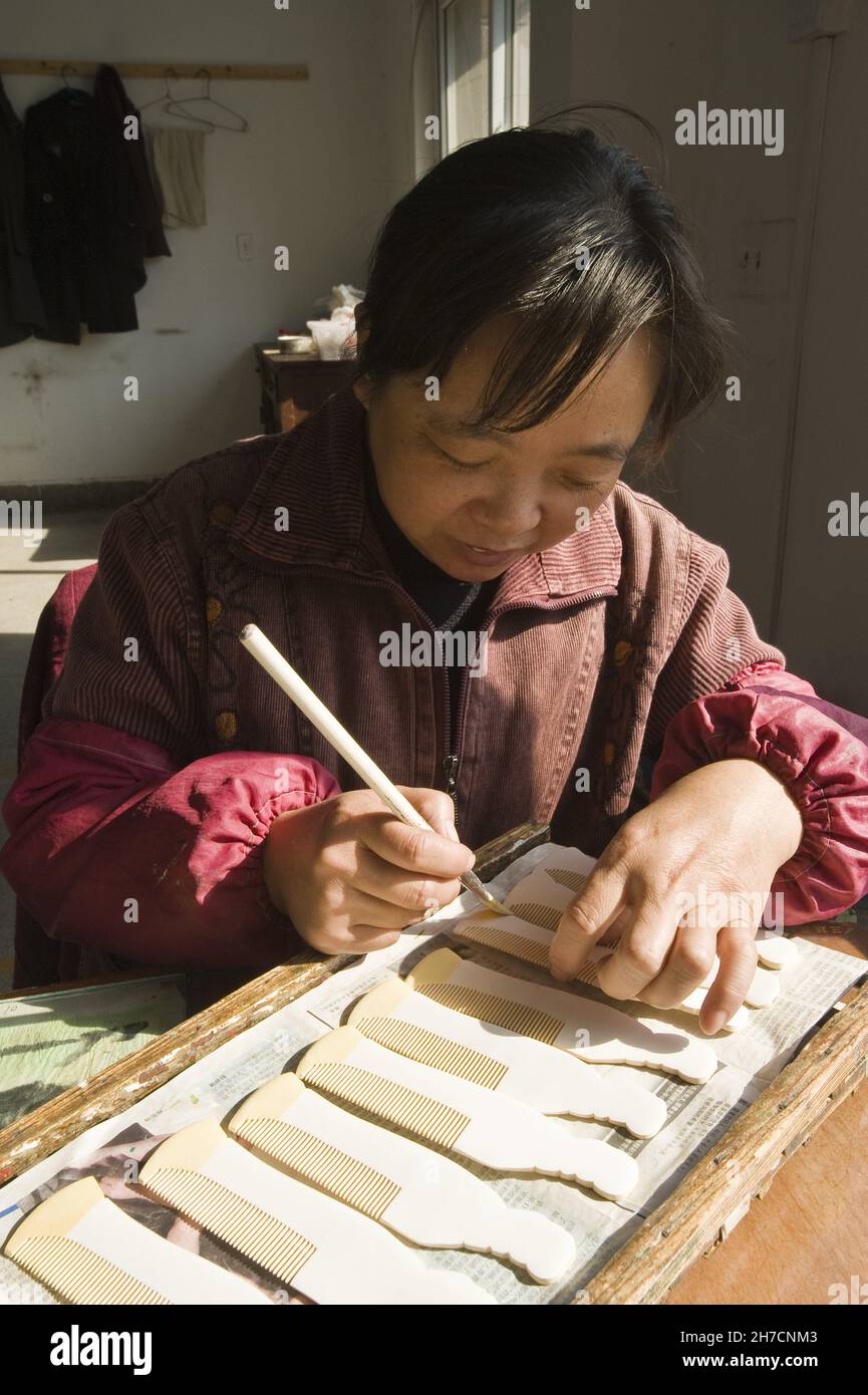 woman working in comb factory, China, Changzhou Stock Photo