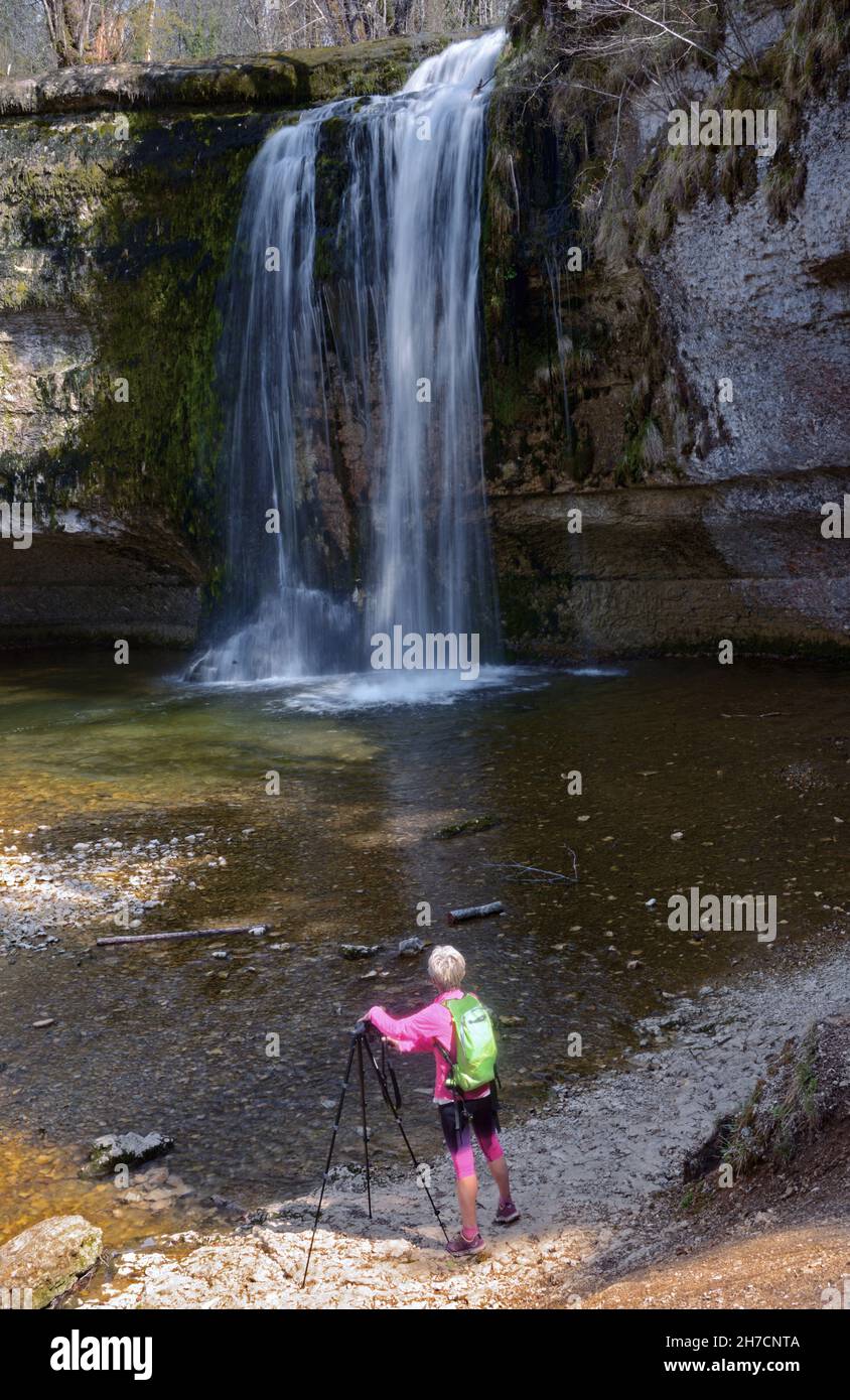 Woman on the footpath to the Herisson waterfalls, France, Jura, Chaux du Dombief Stock Photo