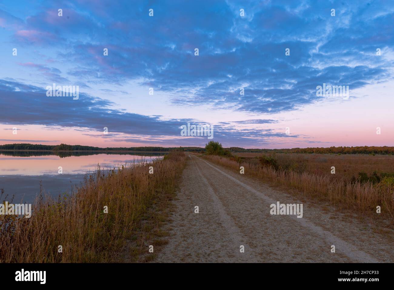 Long sandy road with a trail at the Burrage Pond Wildlife Management