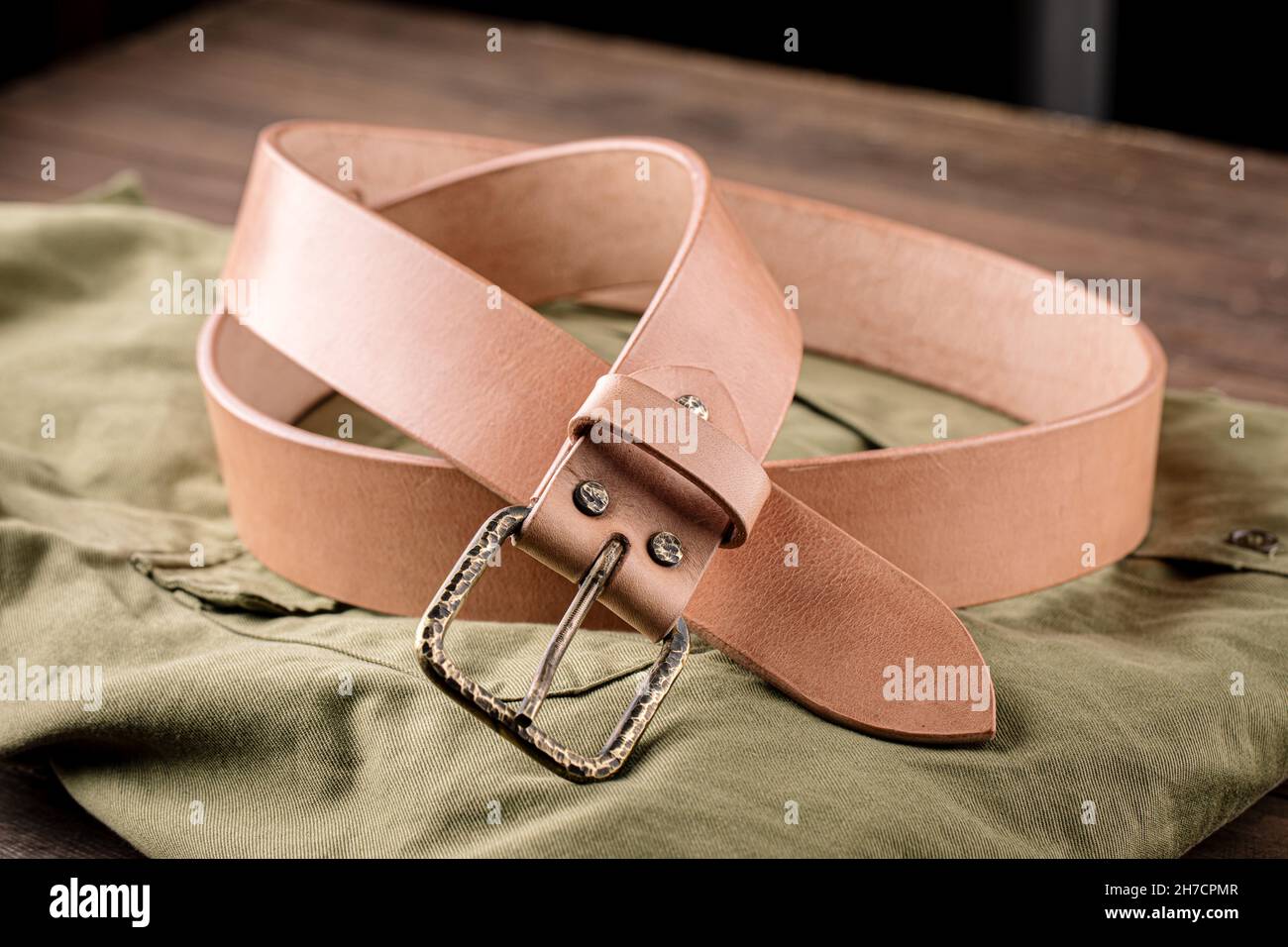 Handcrafted light brown leather strap belt Stock Photo Alamy