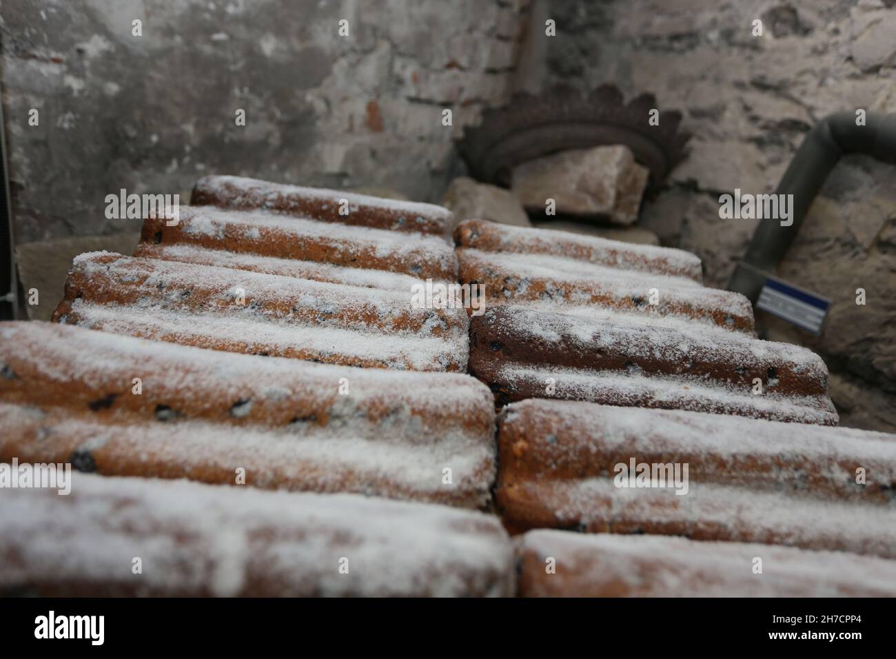 Wernigerode, Germany. 17th Nov, 2021. Freshly baked Stollen are stored in the Wernigerode castle for further maturing. Here the popular Christmas pastry is stored for several weeks in a constant climate for further maturing. The Schlosstollen is then sold in the regional trade. Credit: Matthias Bein/dpa-Zentralbild/ZB/dpa/Alamy Live News Stock Photo