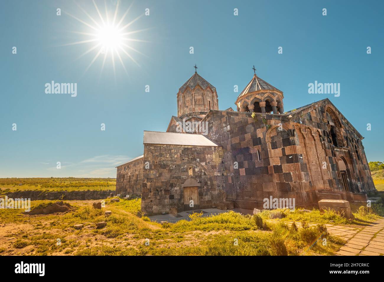 Hovhannavank monastery and church exterior against bright sun background. Travel and religious destinations and attractions in Armenia Stock Photo