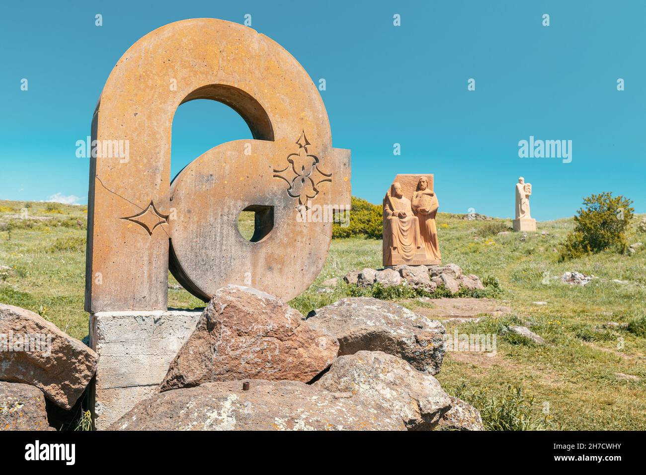 19 May 2021, Aragatsotn, Armenia: Armenian alphabet monument with stone sculptures of letters and Mesrop Mashtots Stock Photo