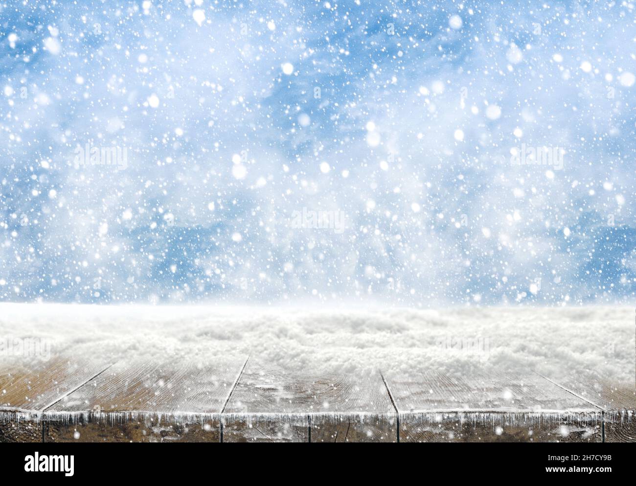 Xmas winter background and rustic table of wood with snow on top ...