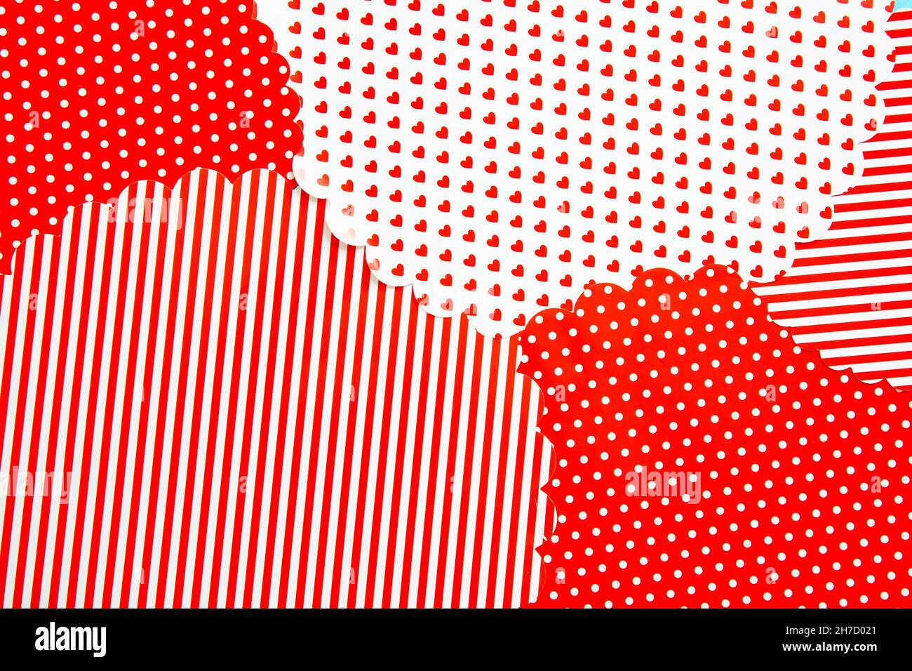 Red white festive pattern, Christmas wrapping paper background. Stripes hearts and dots minimal Xmas presents design. Stock Photo