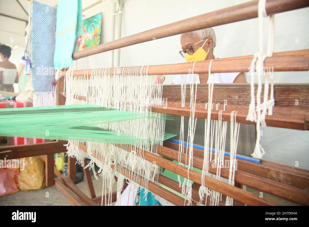 salvador, bahia, brazil - november 20, 2021: Woman is seen working on hand loom in Salvador city. Stock Photo
