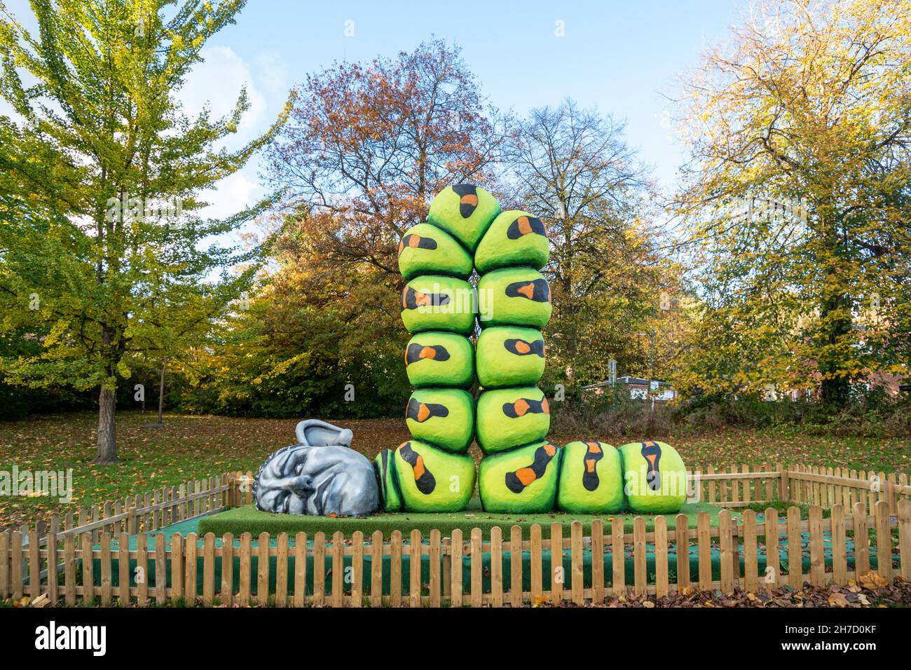 Alfie Bradley caterpillar sculpture with human head in Dale End Park in Ironbridge, Shropshire, England, UK, during autumn or November Stock Photo