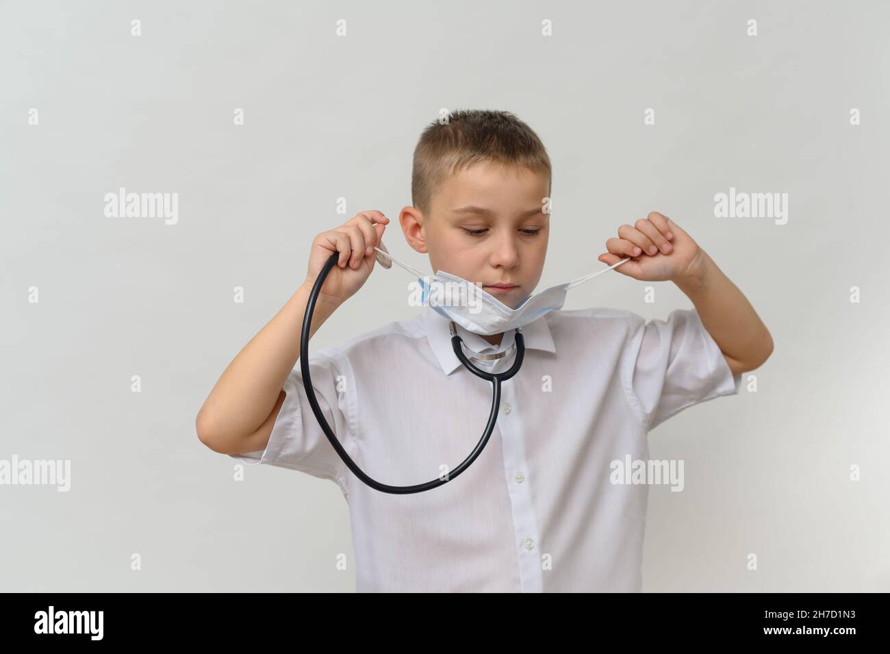 a little boy doctor with a stethoscope Stock Photo