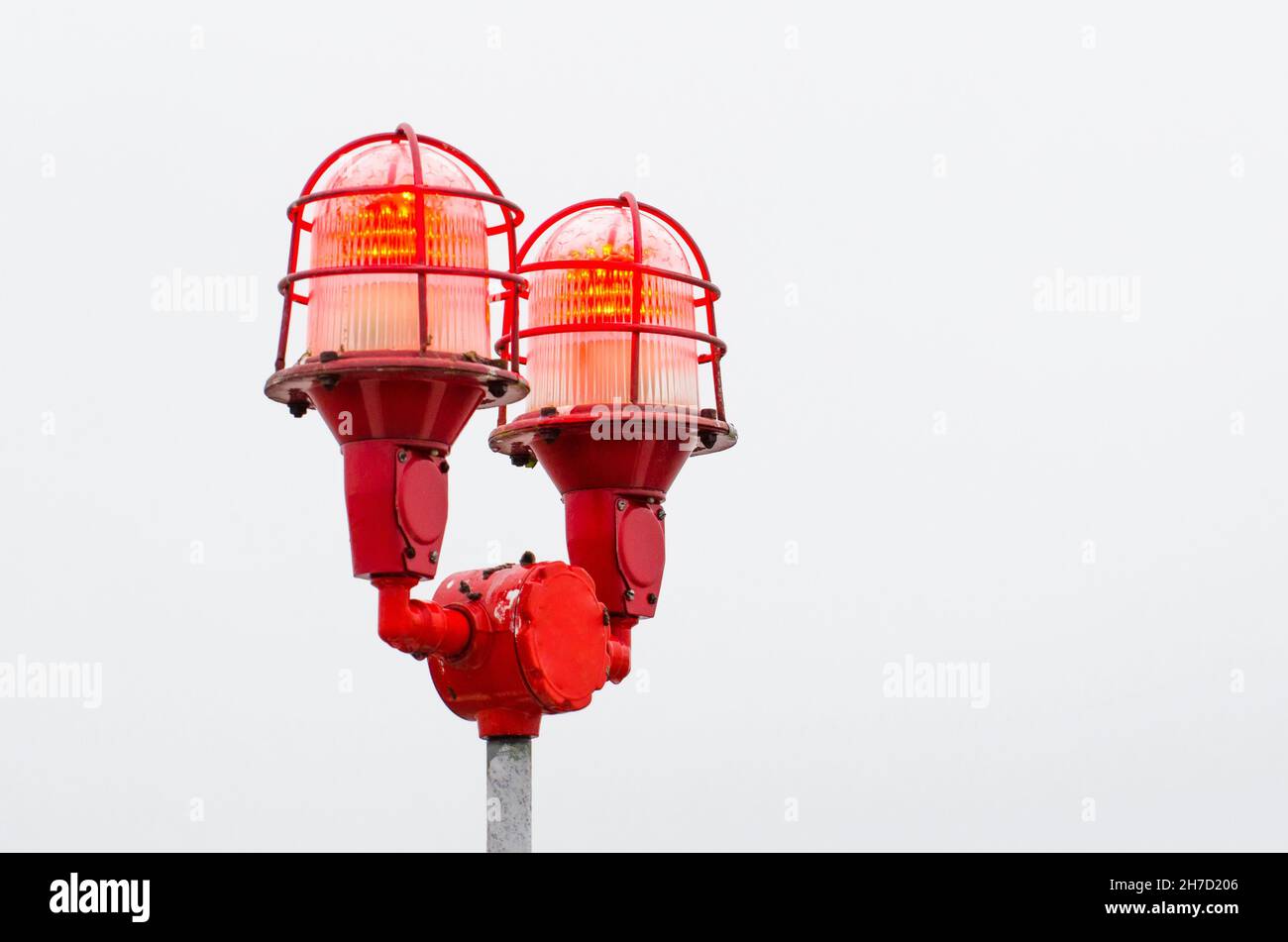 Red warning lights of the lamp, warning at the edges of high buildings objects Stock Photo