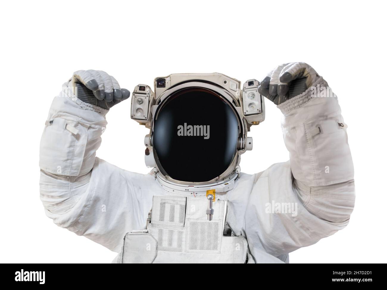 Astronaut in space suit rises hands up isolated on white background. Elements of this image furnished by NASA Stock Photo