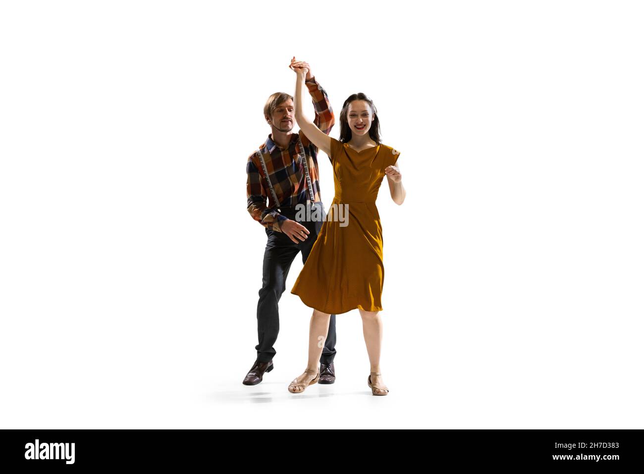 Dynamic portrait of stylish dancers, young man and woman in vintage