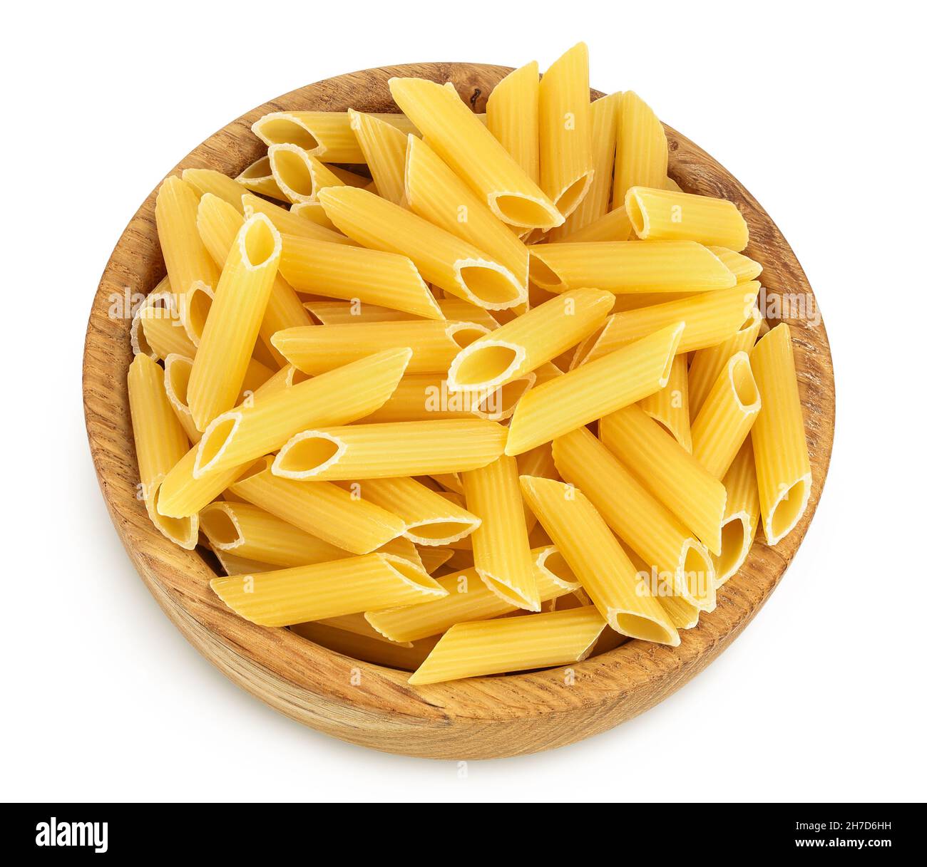 Raw italian penne rigate pasta in wooden bowl isolated on white background with clipping path and full depth of field. Top view. Flat lay Stock Photo