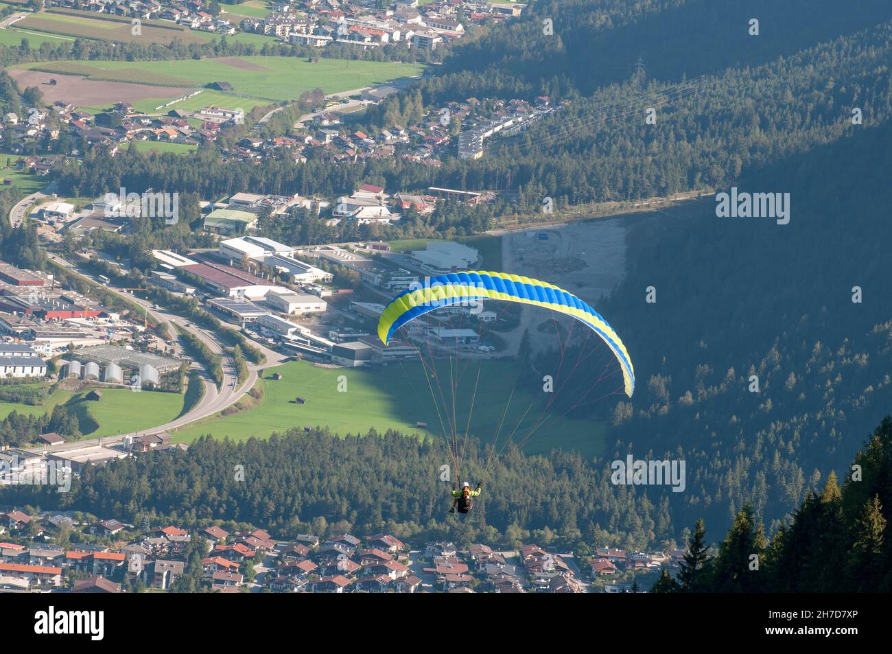 Paragliding from the summit of Elfer mountain down to Neustift im Stubaital, Tyrol, Austria Stock Photo