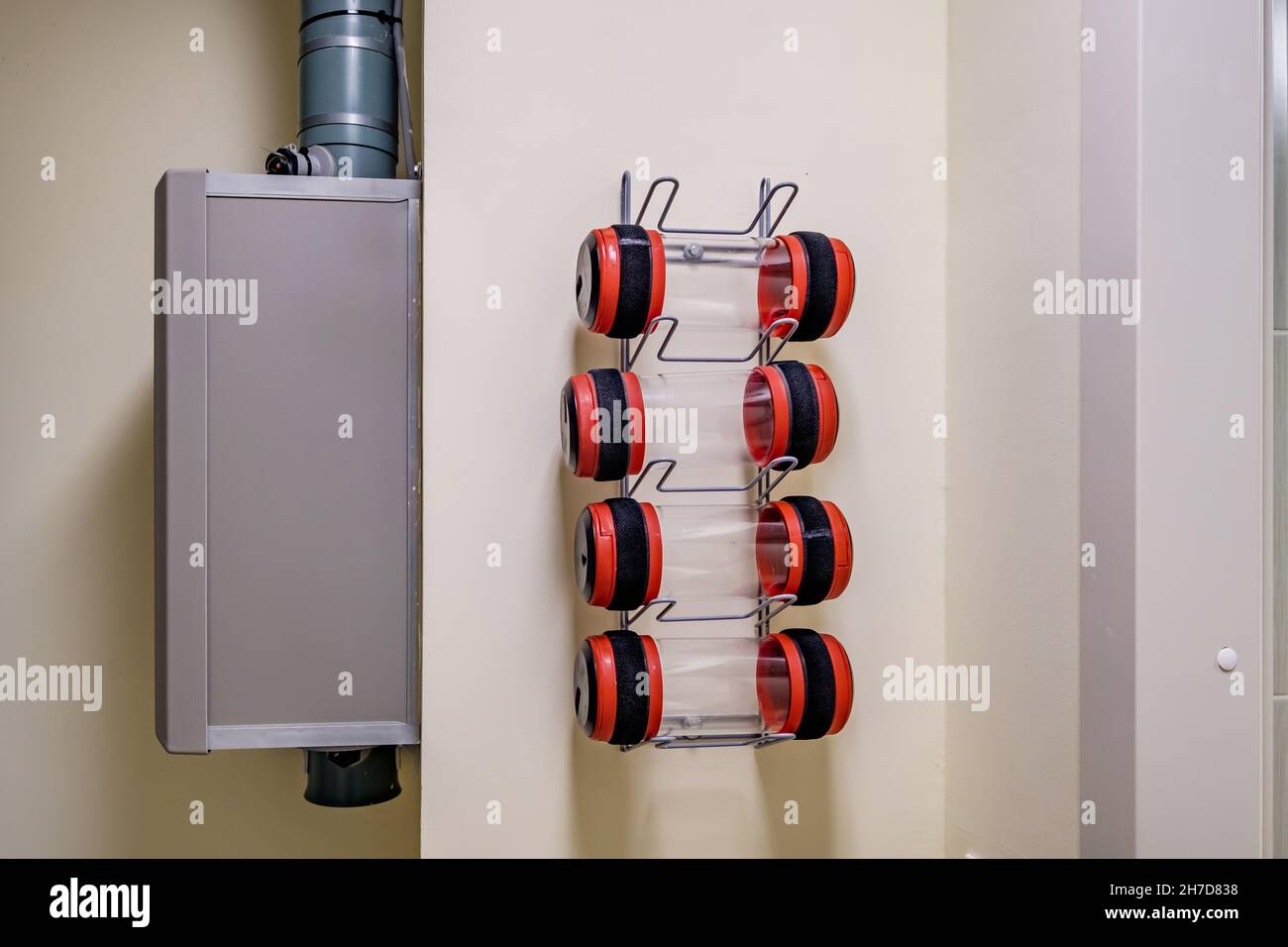 rows of empty pneumatic tubes of transfer system station in modern clinic, designed for fast operational transfer of analyzes, drugs and documents thr Stock Photo
