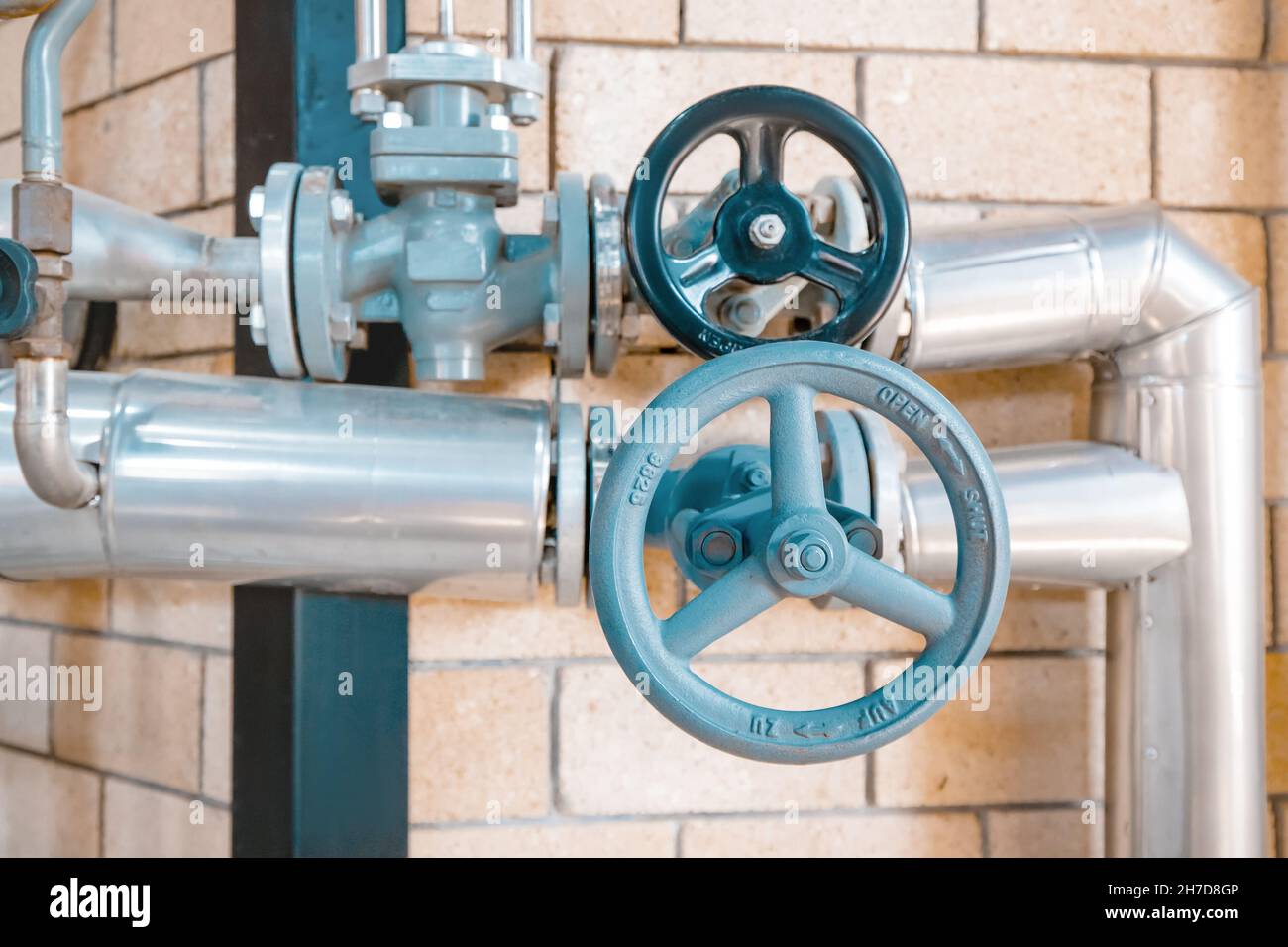 A system of heating pipes with valves leading from the boiler in the ...