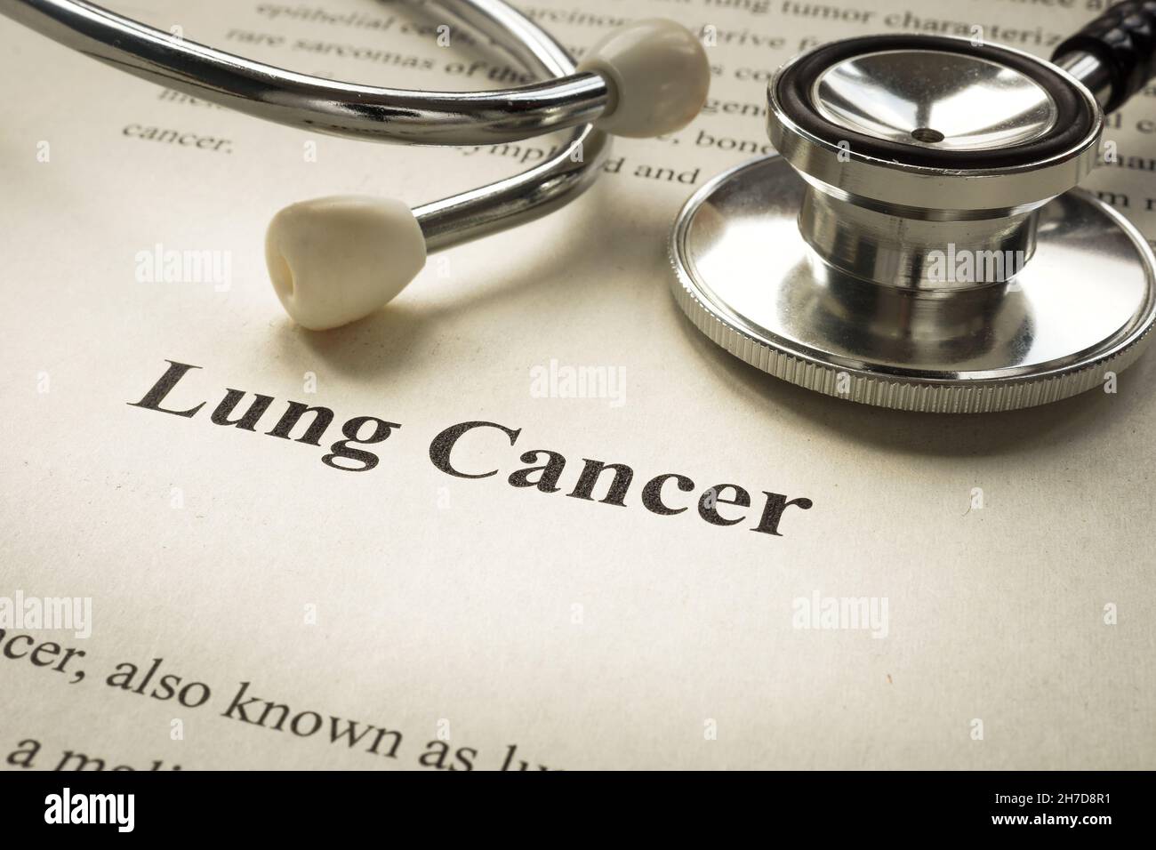 Page with info about lung cancer and stethoscope. Stock Photo