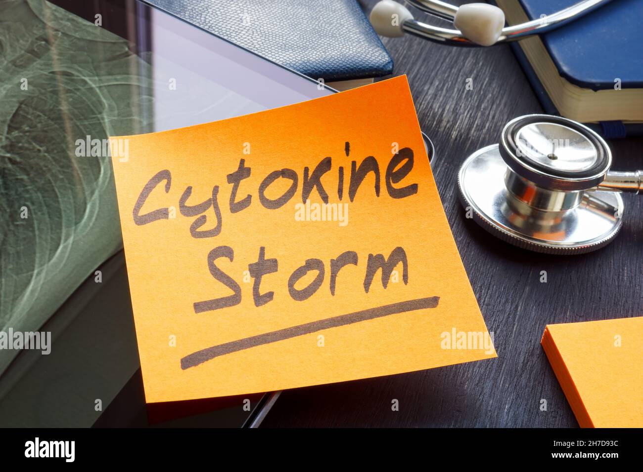 Cytokine storm memo sticker on the hospital table. Stock Photo
