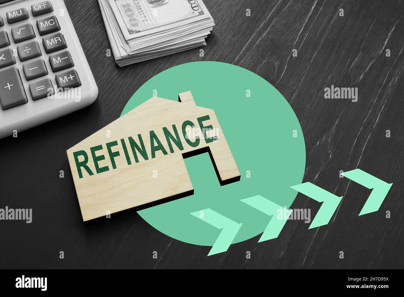 Small wooden house with word refinance for mortgage Stock Photo - Alamy