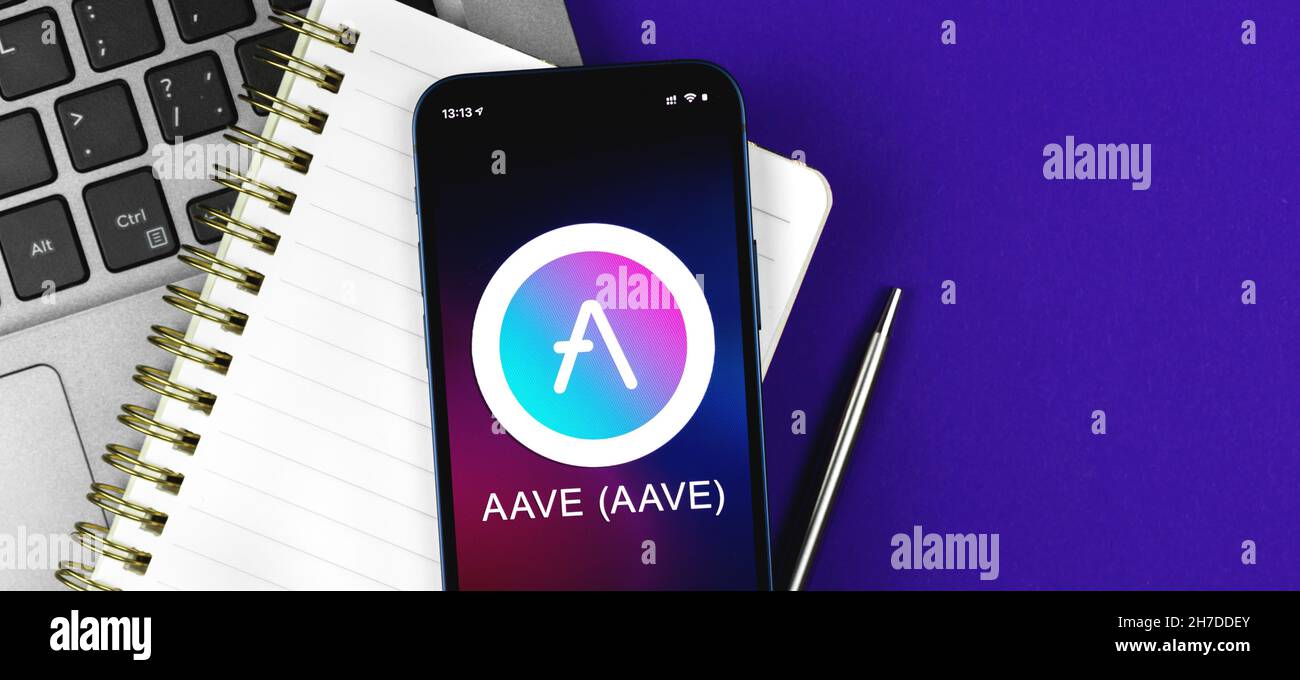 AAVE symbol. Trade with cryptocurrency, digital and virtual money, banking  with mobile phone concept. Business workspace, banner, table top view Stock  Photo - Alamy