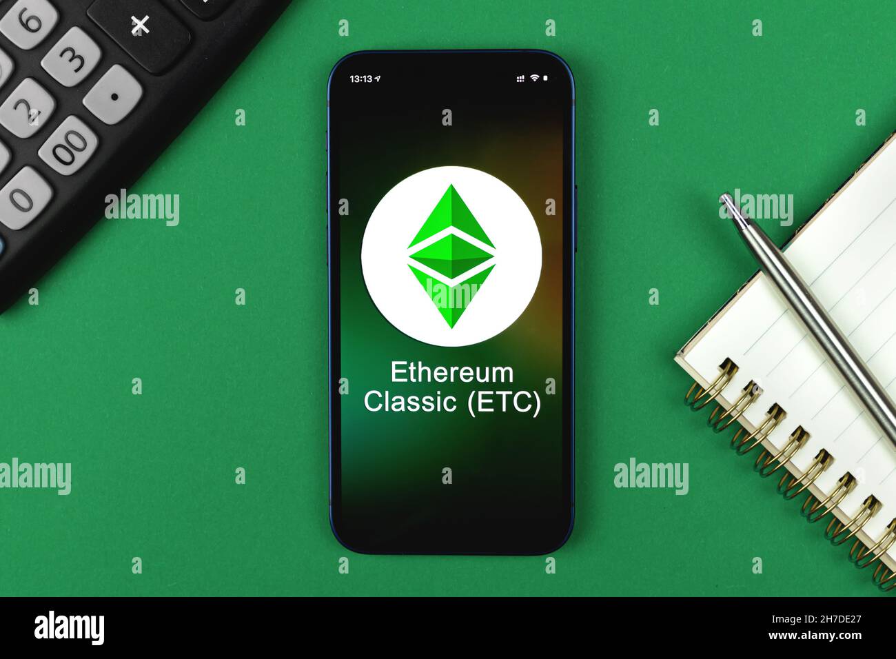 Ethereum Classic ETC symbol. Trade with cryptocurrency, digital and virtual money, banking with mobile phone concept. Business workspace, table top vi Stock Photo