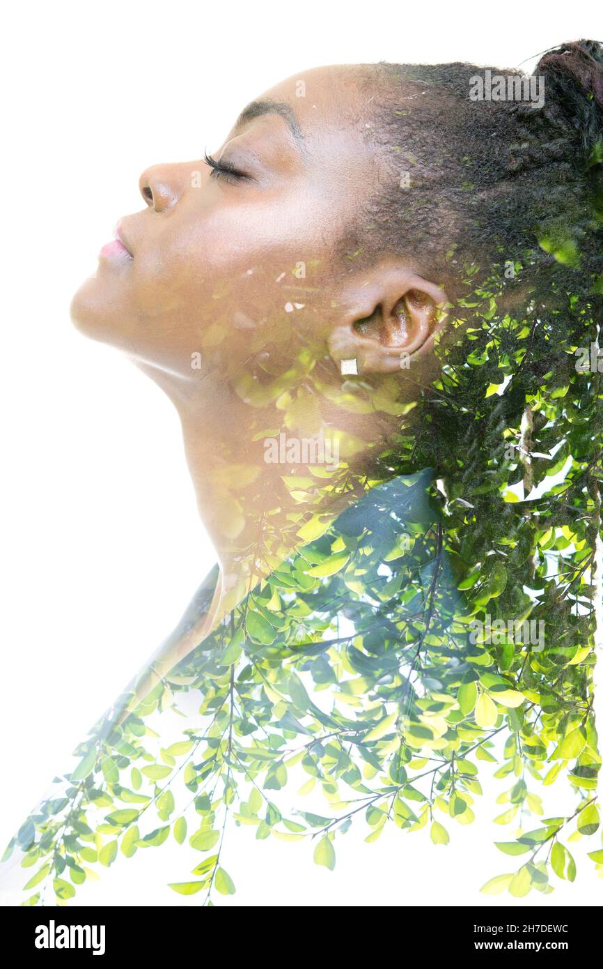 A profile portrait of a woman combined with an image of nature. Double ...