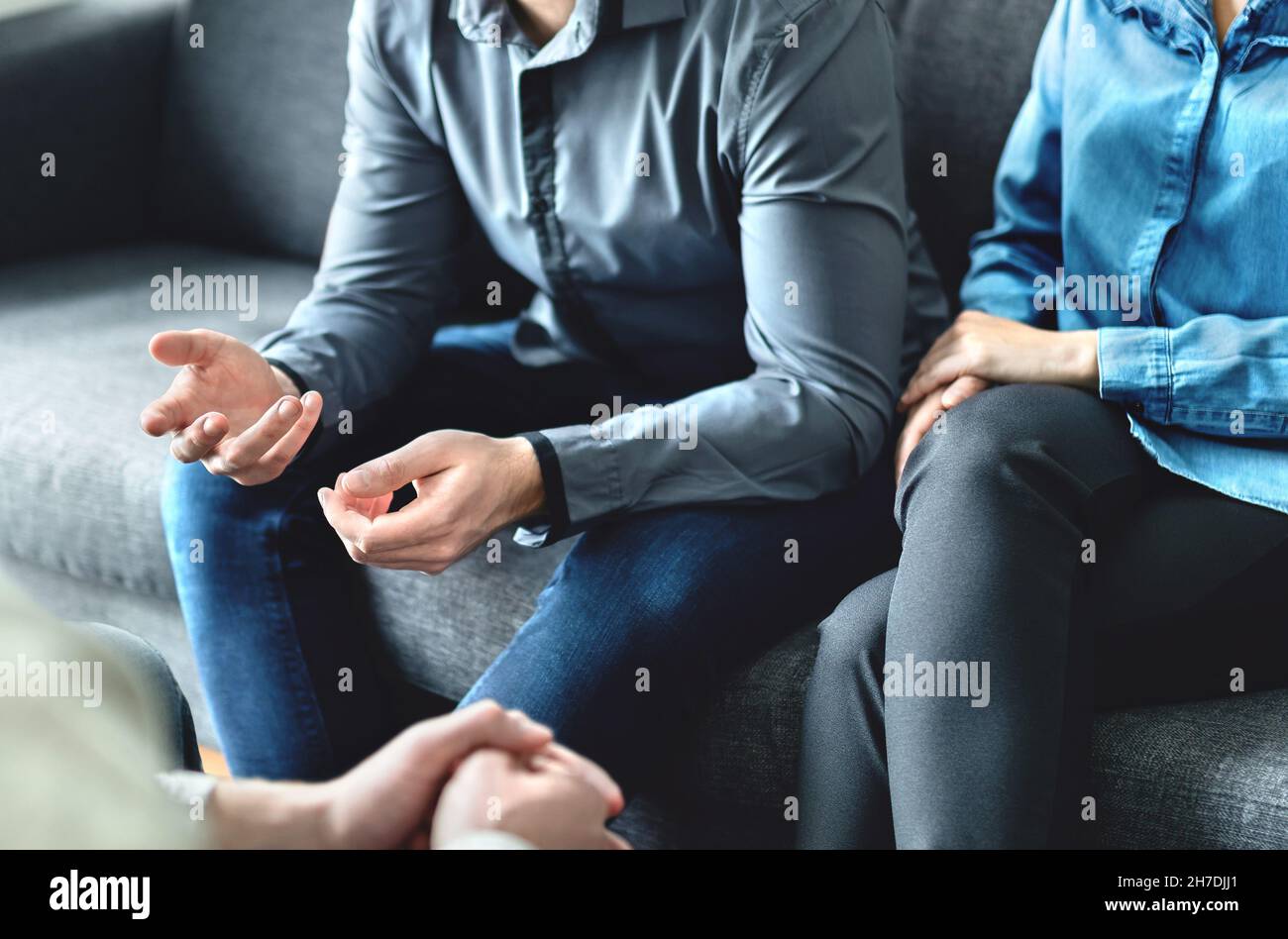 Mediator or family counsel with couple in therapy meeting. Divorce lawyer, marriage counselor, psychologist or doctor interview upset man and woman. Stock Photo