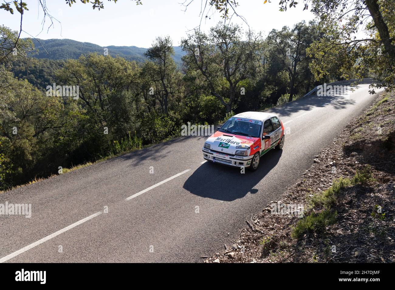 Renault Clio 16 valve taking part in the timed section of the Rally Costa Brava 2021 in Girona, Spain Stock Photo