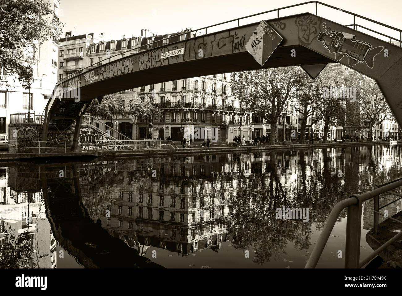 Canal Saint-Martin in autumn. Paris, France. Beautiful reflection. Sepia historic photo Stock Photo