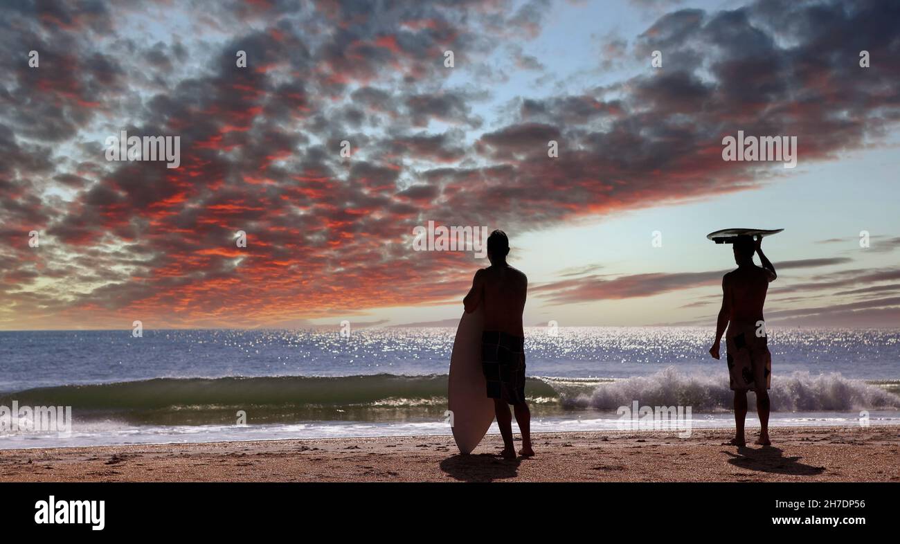 two surfers wainting for the wave in Cocoa Beach, Florida, usa, at