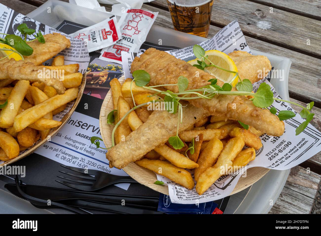 October 10, 2021 - Hundested, Denmark: A plate of delicious fish and chips. Business as usual in the restaurants in the marina Stock Photo